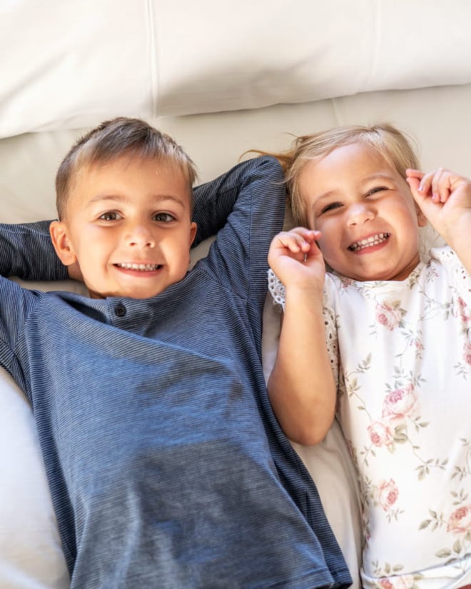 Children smiling in a hotel room