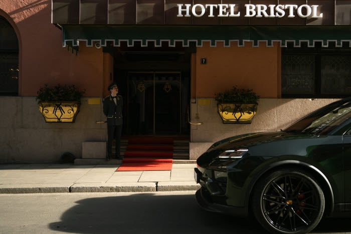 Dark car in front of the Hotel Bristol in the sunshine.