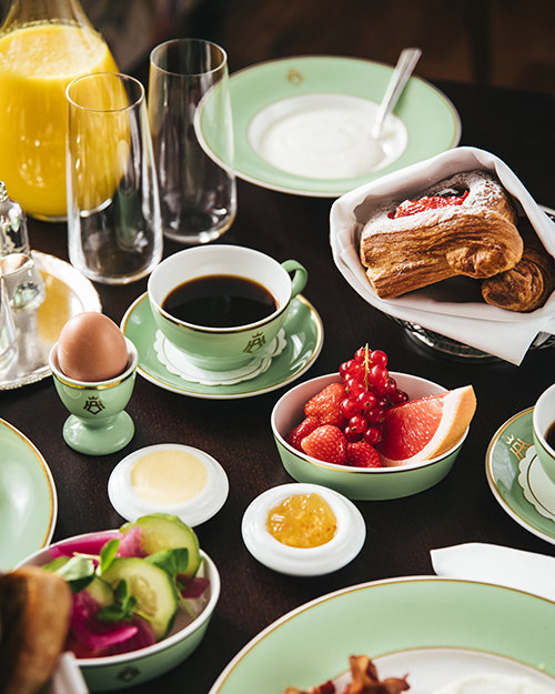 A bountiful breakfast buffet with healthy fruit, eggs, coffee and freshly squeezed juices